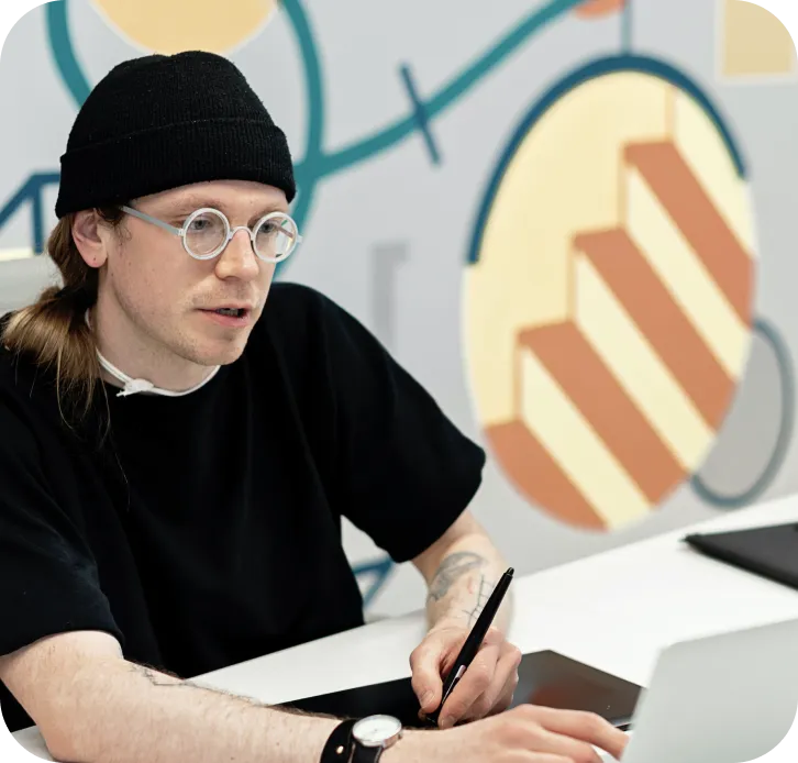 A designer sketching at their desk
